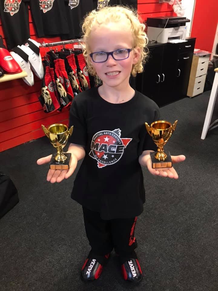 Young MACE student showing achievement after training